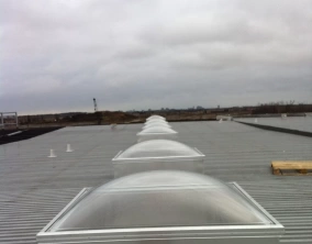 Clear Acrylic Dome Skylight with Frost Free Frames on an Aluminum Curb