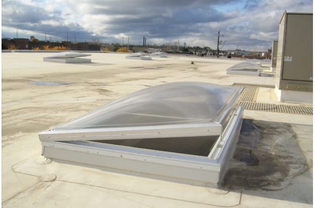 Electric venting skylight with aluminum curbs