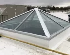 Pyramid skylight on a reflective roof