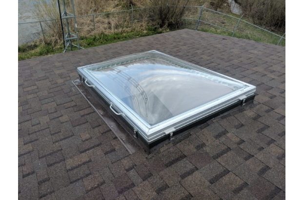 Removable Skylight with Clear Acrylic Domes on a Sloped Shingle Roof