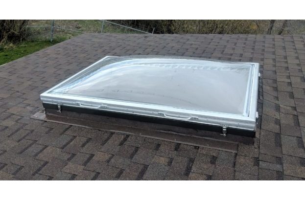 Removable Skylight with Clear Acrylic Domes on a Sloped Shingle Roof