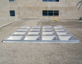 Clear Acrylic Butted Domes on Flat Ballast Roof