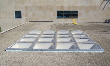 Clear Acrylic Butted Domes on Flat Ballast Roof