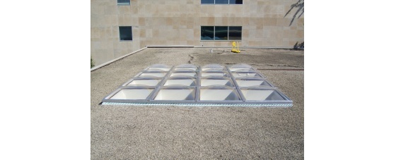 Clear Acrylic Butted Domes on Flat Ballast Roof