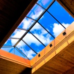 New Installed glass pyramid skylight over wood cladded pool area
